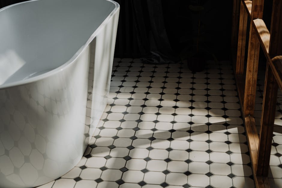 Contractor installing bathroom floor tiles